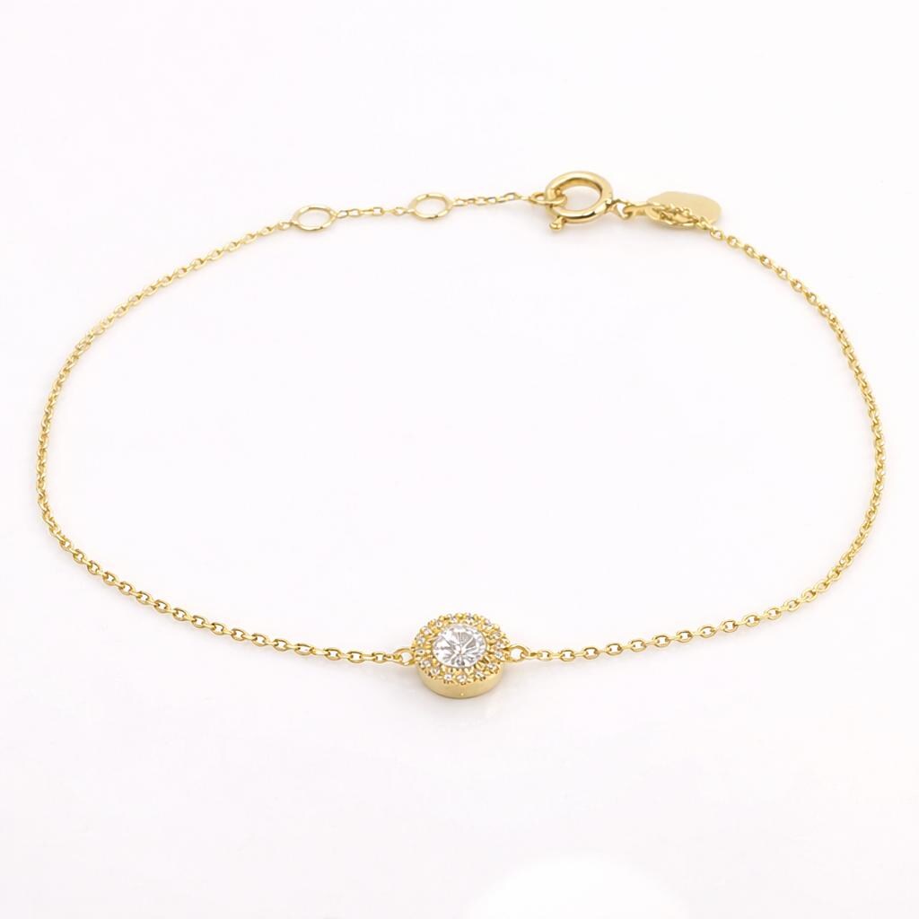 Bracelet Guérin en or jaune 750, chaîne fine et motif rond serti de 17 diamants.